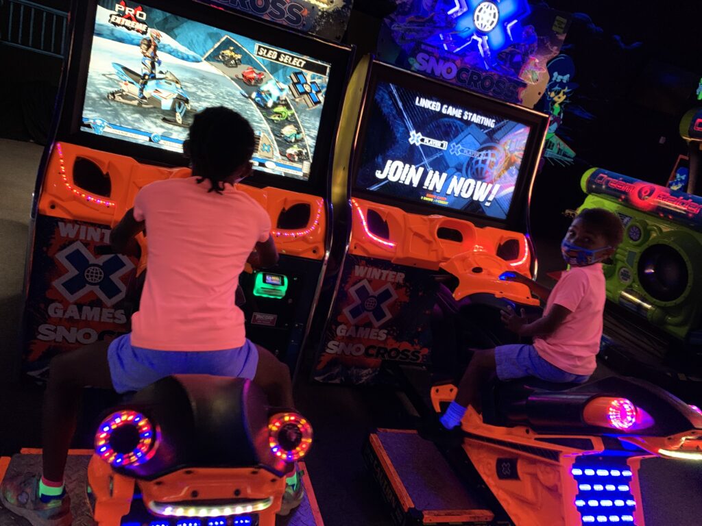 Playing in the Arcade at Monster Mini Golf
